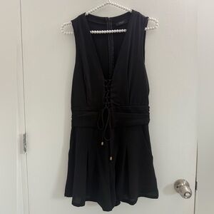 Trac Black Sleeveless Romper – Lace-Up Front Detail